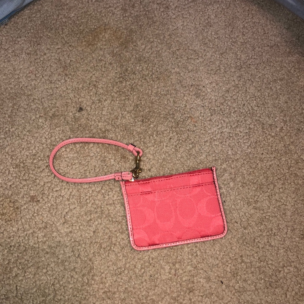 Mini Coach wristlet.